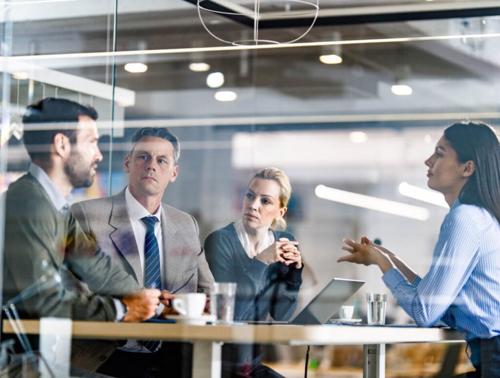 People working in a conference room.