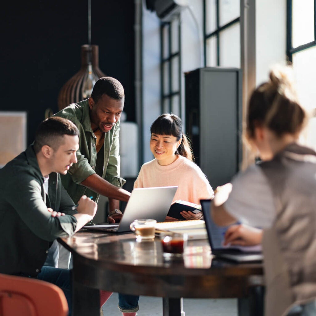 Group of business persons meeting around a table